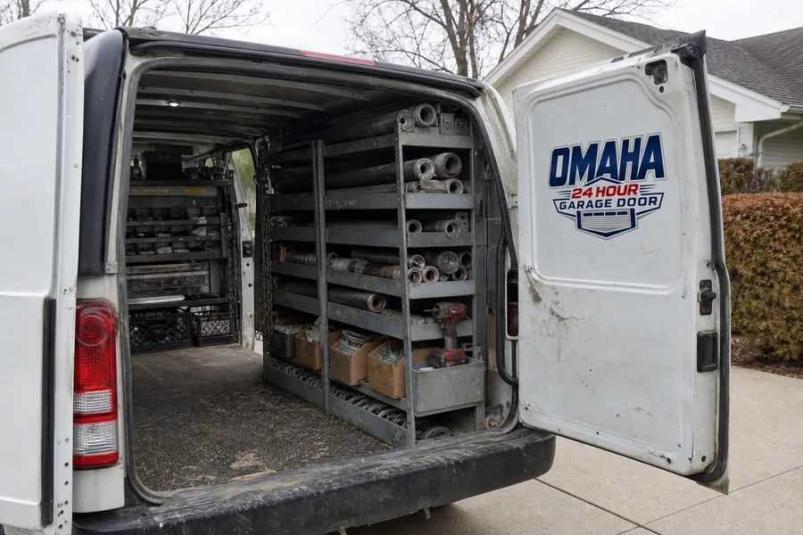A garage door roller in its track in Omaha, NE