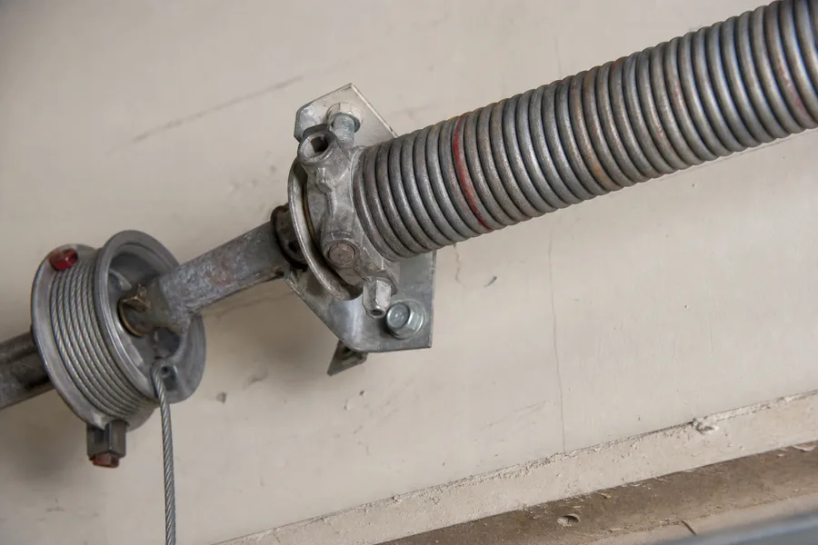 Torsion spring, shaft and cable drum above a garage door in Omaha, NE